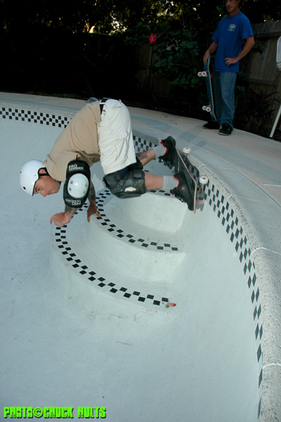 Pool Owner Dave Libhardt grabs a slice of his own personal wedding cake as he barks some dry coping.